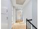 Bright hallway featuring hardwood floors and updated doors with dark hardware at 5465 N Fork Sw Dr, Lilburn, GA 30047
