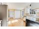Modern kitchen with wood floors, granite countertops, stainless steel appliances and bright natural light at 5465 N Fork Sw Dr, Lilburn, GA 30047