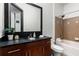 Bathroom features a large mirror and dark wood vanity and a tiled shower-tub combination at 747 Ralph Mcgill Ne Blvd # 223, Atlanta, GA 30312