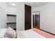 Cozy bedroom featuring an open closet and dark wood wardrobe for ample storage solutions at 747 Ralph Mcgill Ne Blvd # 223, Atlanta, GA 30312