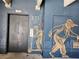 The elevator entrance is creatively adorned with artistic drawings at 747 Ralph Mcgill Ne Blvd # 223, Atlanta, GA 30312