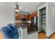 Stylish kitchen with modern appliances, breakfast bar and three bar stools overlooking dining area at 747 Ralph Mcgill Ne Blvd # 223, Atlanta, GA 30312