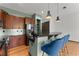 Modern kitchen with stainless steel appliances, granite countertops, and a breakfast bar with blue bar stools at 747 Ralph Mcgill Ne Blvd # 223, Atlanta, GA 30312