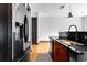 Modern kitchen with stainless steel refrigerator, granite countertops, and hardwood floors at 747 Ralph Mcgill Ne Blvd # 223, Atlanta, GA 30312