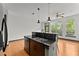 Modern kitchen with stainless steel appliances, granite countertops, and breakfast bar overlooking dining area at 747 Ralph Mcgill Ne Blvd # 223, Atlanta, GA 30312