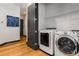 Efficient laundry area with white washer and dryer units and overhead shelving at 747 Ralph Mcgill Ne Blvd # 223, Atlanta, GA 30312