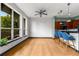 Bright living space features hardwood floors, modern ceiling fan, and a large window with a view at 747 Ralph Mcgill Ne Blvd # 223, Atlanta, GA 30312