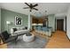 Open concept living area featuring a breakfast bar, ceiling fan, and modern furnishings at 747 Ralph Mcgill Ne Blvd # 223, Atlanta, GA 30312