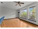 Bright living room with hardwood floors, large windows overlooking trees, and stylish blue bar stools at 747 Ralph Mcgill Ne Blvd # 223, Atlanta, GA 30312