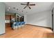Open-concept living area featuring a breakfast bar, stainless appliances, hardwood floors, and neutral walls at 747 Ralph Mcgill Ne Blvd # 223, Atlanta, GA 30312