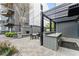 Outdoor kitchen featuring modern appliances, a grill, and a cozy seating area at 747 Ralph Mcgill Ne Blvd # 223, Atlanta, GA 30312