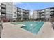 Community swimming pool offers a relaxing space surrounded by modern apartment buildings at 747 Ralph Mcgill Ne Blvd # 223, Atlanta, GA 30312