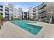 Community swimming pool with lounge chairs and an apartment building in the background at 747 Ralph Mcgill Ne Blvd # 223, Atlanta, GA 30312