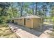 A view of the home's exterior, featuring a small patio and fenced yard at 1667 Hollyhock Ter, Decatur, GA 30032