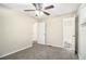 Inviting bedroom with neutral carpet and walls, showing closet and bathroom entries for convenience at 1667 Hollyhock Ter, Decatur, GA 30032