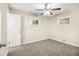 Cozy bedroom featuring soft carpet, neutral walls, and natural light from two windows, creating a serene retreat at 1667 Hollyhock Ter, Decatur, GA 30032