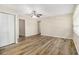 Spacious living room with stylish wood floors, ample natural light, and a modern ceiling fan at 1667 Hollyhock Ter, Decatur, GA 30032