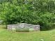 Entrance sign to Georgian Hills Park surrounded by lush greenery on a sunny day at 1914 Bragg St, Brookhaven, GA 30341