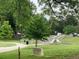 View of park with paved path, steps, benches, trees, and greenery at 1914 Bragg St, Brookhaven, GA 30341