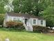 Charming single story home with gray siding and a welcoming front entrance, surrounded by mature trees at 2771 Georgian Dr, Brookhaven, GA 30341