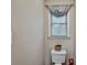 Small bathroom with neutral paint, wood floors and toilet at 59 Sentry Rdg, Dallas, GA 30157