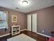 Cozy bedroom with wood floors, plush rug, window, and a decorative ceiling design at 59 Sentry Rdg, Dallas, GA 30157