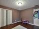 Bedroom featuring wood floors, textured ceiling, play area, and closet space at 59 Sentry Rdg, Dallas, GA 30157