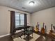 Bedroom featuring wood floors, a window with blinds, and musical instruments at 59 Sentry Rdg, Dallas, GA 30157