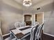 Elegant dining room featuring a modern chandelier, dining table, and views to the living room at 59 Sentry Rdg, Dallas, GA 30157