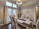 Dining room featuring chandelier, neutral colors and dining set at 59 Sentry Rdg, Dallas, GA 30157