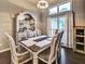 Formal dining room with chandelier, wooden table, upholstered chairs and storage at 59 Sentry Rdg, Dallas, GA 30157