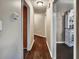 Hallway featuring hardwood floors connecting rooms with neutral color schemes at 59 Sentry Rdg, Dallas, GA 30157