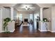 Spacious living room features a stone fireplace, hardwood floors, large windows, and views to the entry and back yard at 59 Sentry Rdg, Dallas, GA 30157