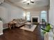 Inviting living room boasts hardwood floors, stone fireplace, neutral walls, and large windows that flood the space with light at 59 Sentry Rdg, Dallas, GA 30157
