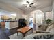 Open-concept living room with hardwood floors, neutral colors, classic columns, and easy access to the kitchen at 59 Sentry Rdg, Dallas, GA 30157