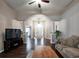Spacious living room with hardwood floors, classic columns, neutral colors, and an open layout for easy entertaining at 59 Sentry Rdg, Dallas, GA 30157