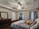 Spacious bedroom featuring a tray ceiling and dark wood floors at 59 Sentry Rdg, Dallas, GA 30157