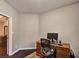 Home office setup with a wooden desk, ergonomic chair, and modern computer equipment at 59 Sentry Rdg, Dallas, GA 30157