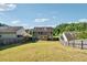 Backyard with privacy fence enclosing grassy area at 7431 St David St, Fairburn, GA 30213