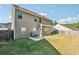 Backyard view with a patio and fenced yard at 7431 St David St, Fairburn, GA 30213