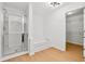Bright bathroom with tiled walk-in shower and separate soaking tub at 7431 St David St, Fairburn, GA 30213