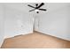 Bedroom featuring a ceiling fan, hardwood floors, and white walls at 7431 St David St, Fairburn, GA 30213