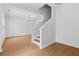 Bright entryway with hardwood floors, a staircase, and neutral walls that create an open, inviting feel at 7431 St David St, Fairburn, GA 30213