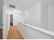 Bright hallway features wood-look flooring, white walls and trim, and access to multiple rooms at 7431 St David St, Fairburn, GA 30213