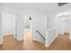 Bright hallway showing access to bedroom and bath, featuring wood-look flooring at 7431 St David St, Fairburn, GA 30213