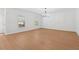 Bright, minimalist living room with hardwood floors and recessed lighting at 7431 St David St, Fairburn, GA 30213