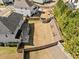 Aerial view of backyard featuring a pergola, wooden fence, and grass at 924 Woodbury Rd, Canton, GA 30114