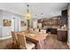 Open concept dining room features a large table with seating and kitchen access at 924 Woodbury Rd, Canton, GA 30114