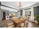 Open concept dining room with natural light, a wooden table, and hardwood flooring at 924 Woodbury Rd, Canton, GA 30114