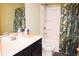 Bright bathroom featuring a white vanity and tropical shower curtain at 1058 Mays Sw Hl, Atlanta, GA 30336